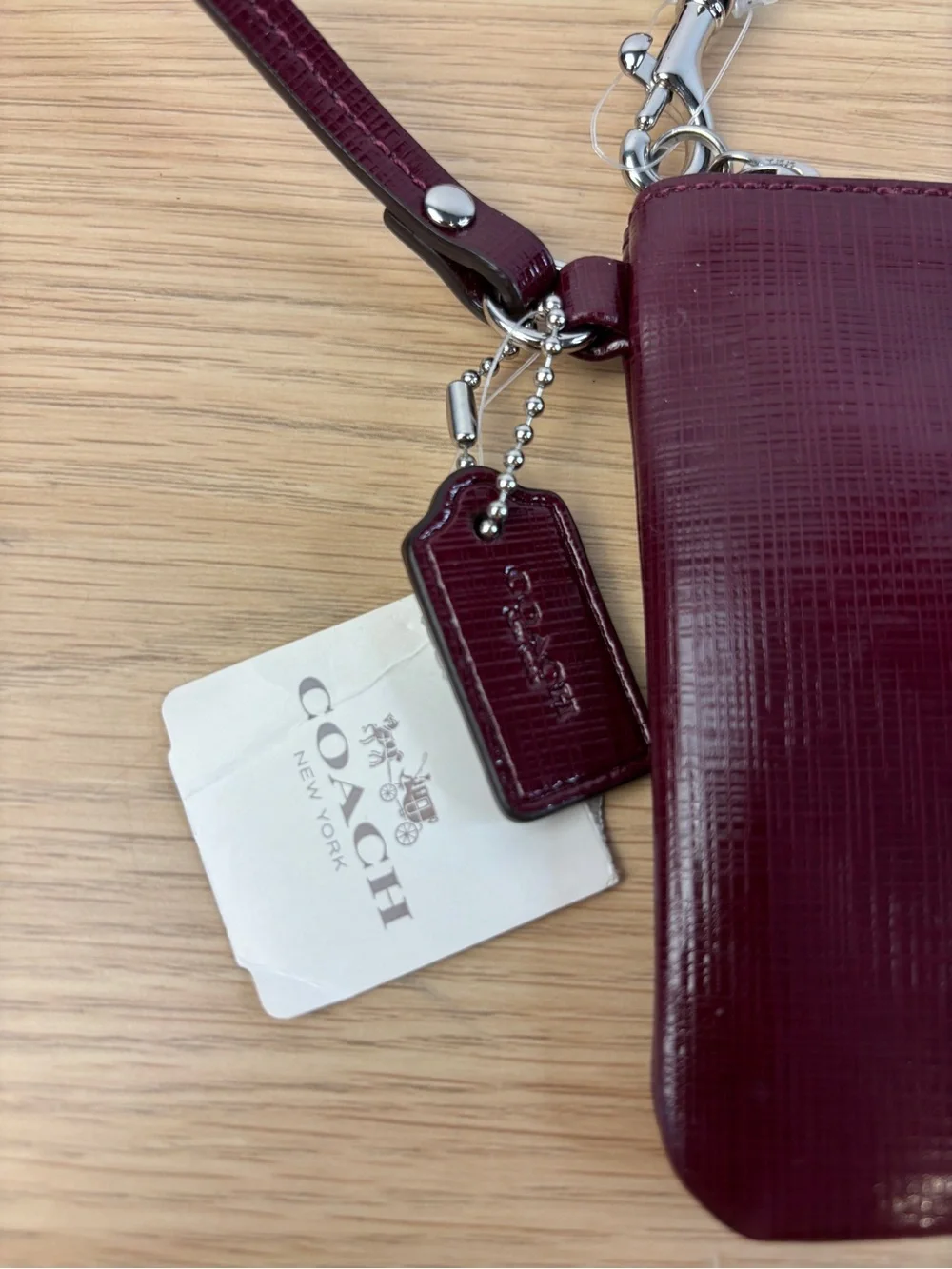 Coach Darcy Patent Leather Bow Small Wristlet in “Sherry” Wine Color NWT